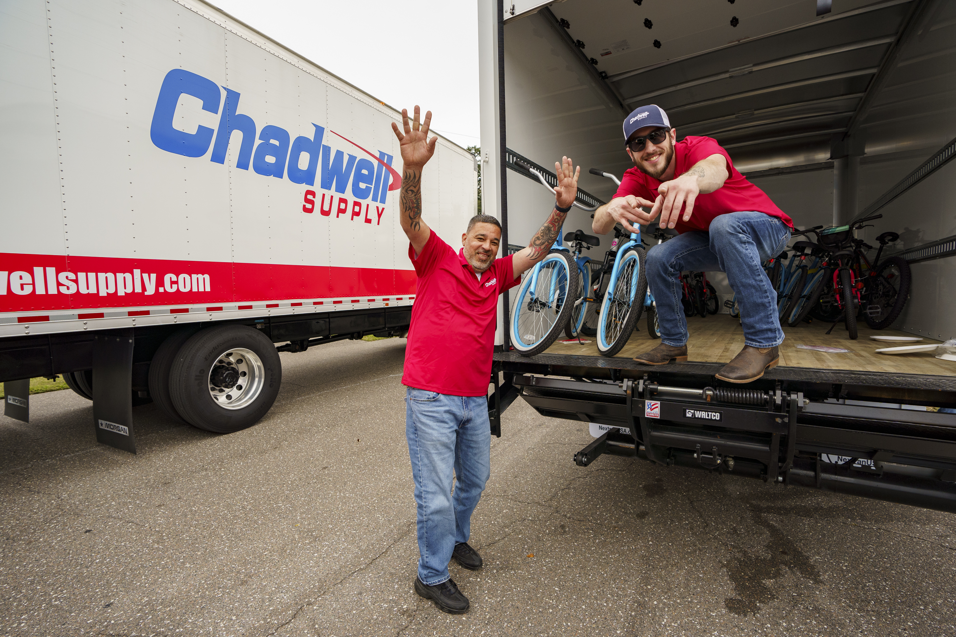 Having fun loading bikes into the Chadwell Supply Trucks